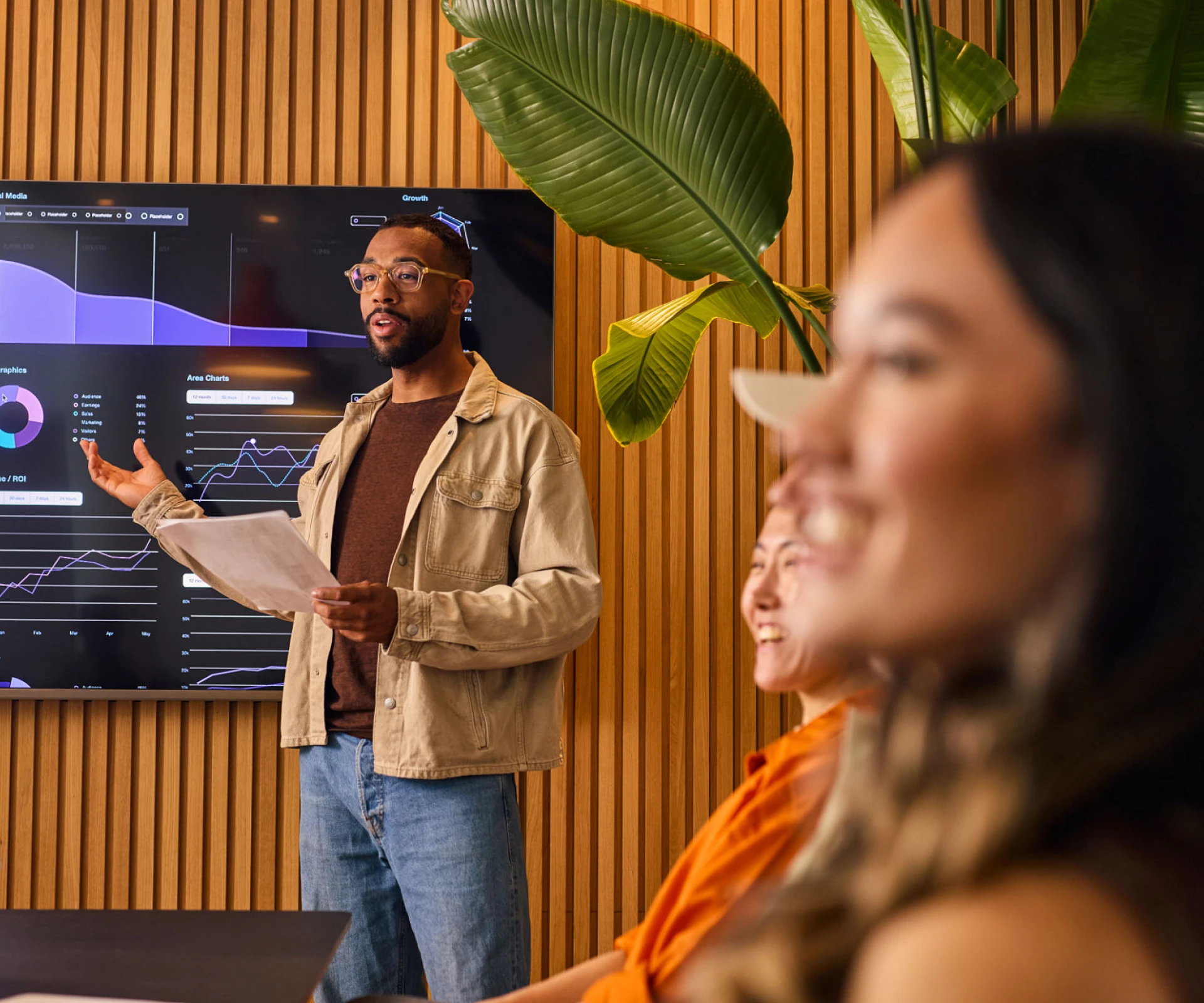 Speaker presenting data to colleagues