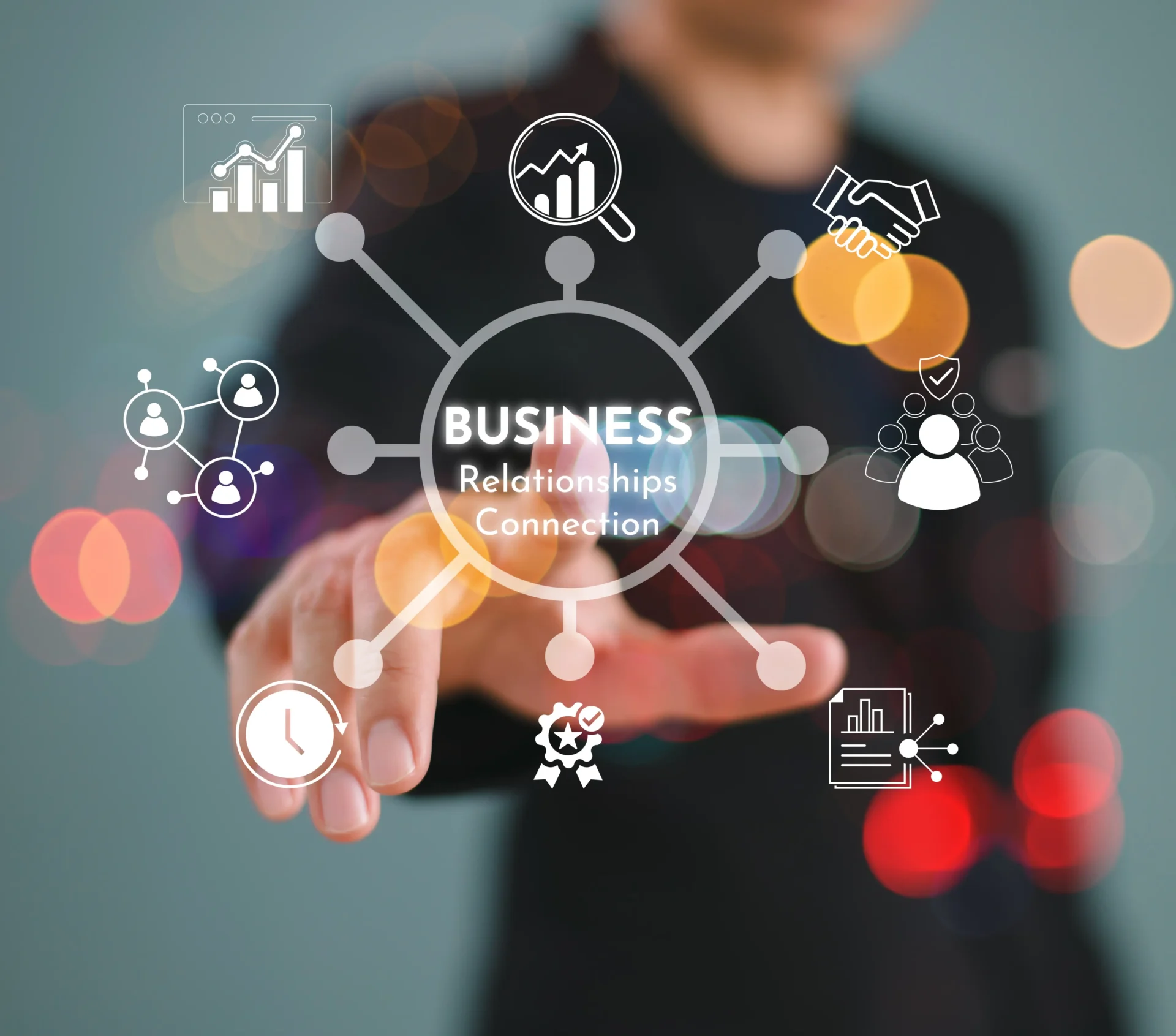 Businessman interacting with digital business icons on transparent screen.